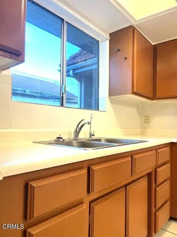a bathroom with a sink and a large mirror