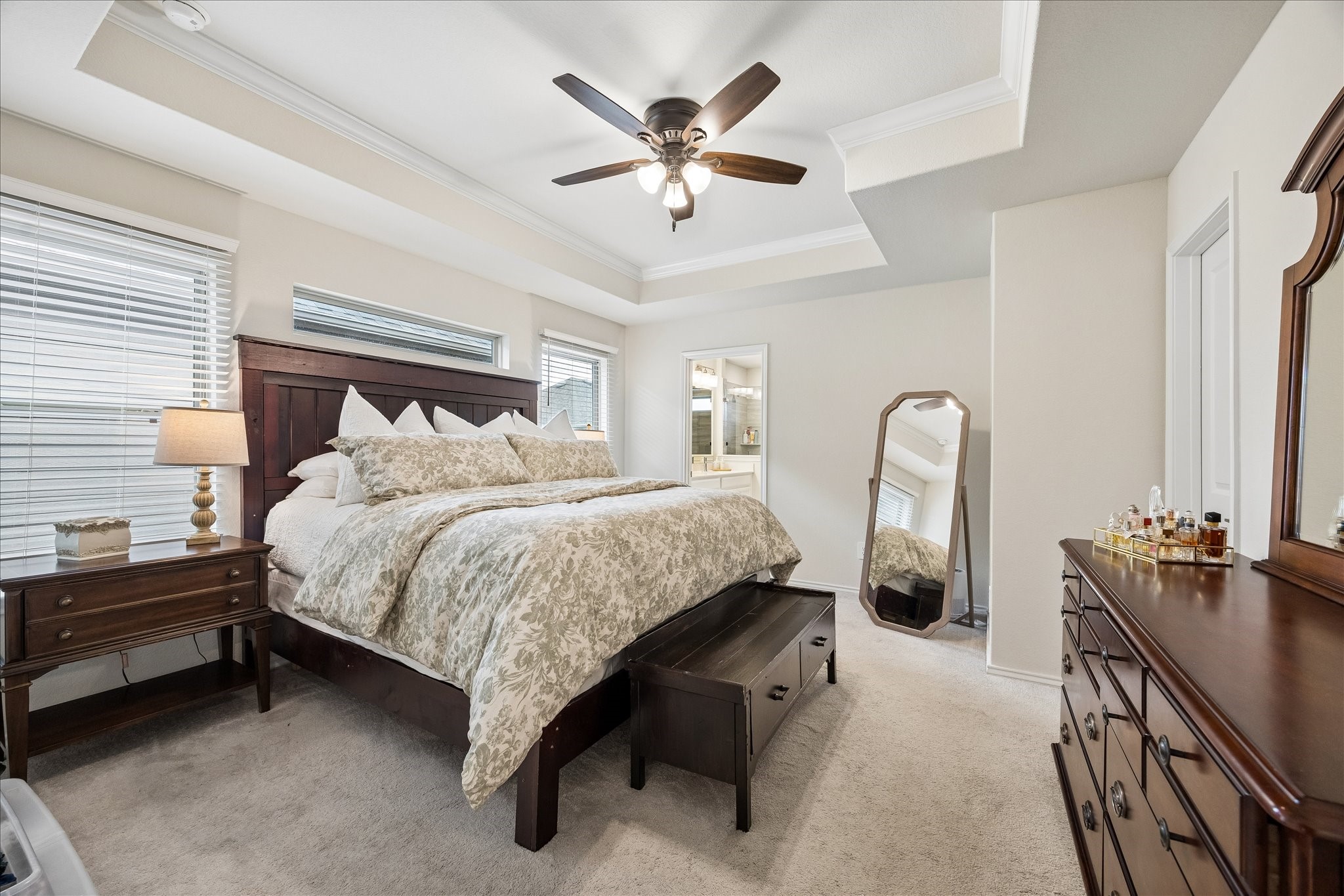 4026 Delta Rose Street Houston, TX 77018 - Photo 16 of 44 The primary bedroom is spacious with a neutral color palette, natural light and offers a private ensuite bathroom.