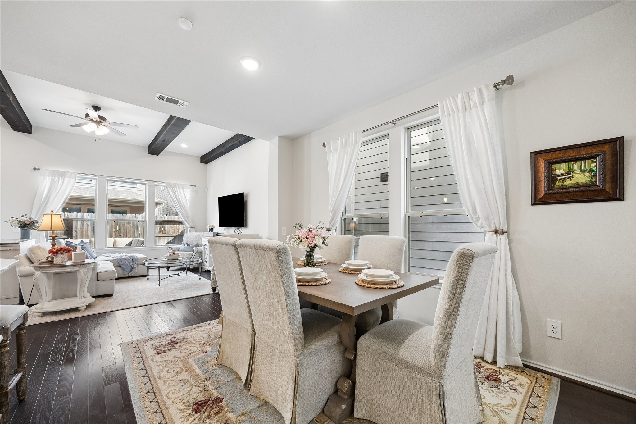 4026 Delta Rose Street Houston, TX 77018 - Photo 5 of 44 Open dining area seamlessly connected to the living space featuring vaulted ceilings with beam accents.