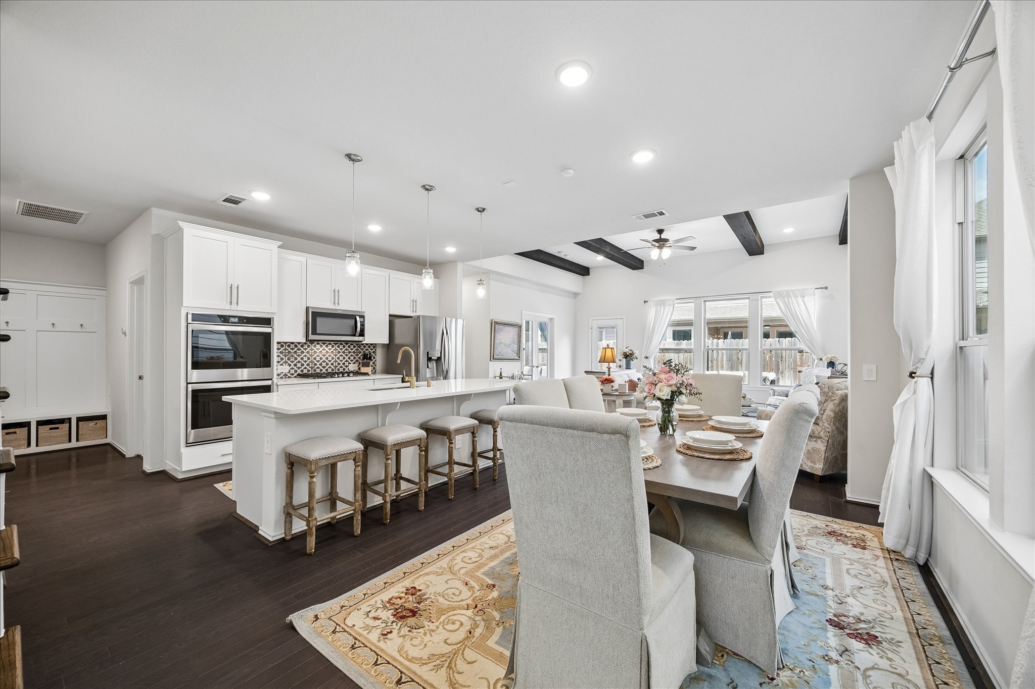 4026 Delta Rose Street Houston, TX 77018 - Photo 6 of 44 Open kitchen with large island and bar seating, quartz countertops, stainless appliances and custom cabnitry.