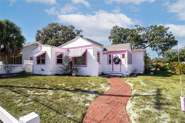 a front view of a house with garden