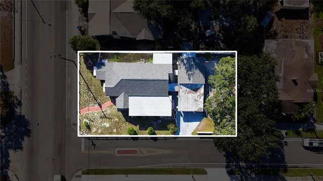 an aerial view of a house having yard