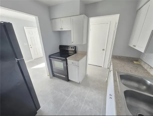 a kitchen with stainless steel appliances a stove and a refrigerator