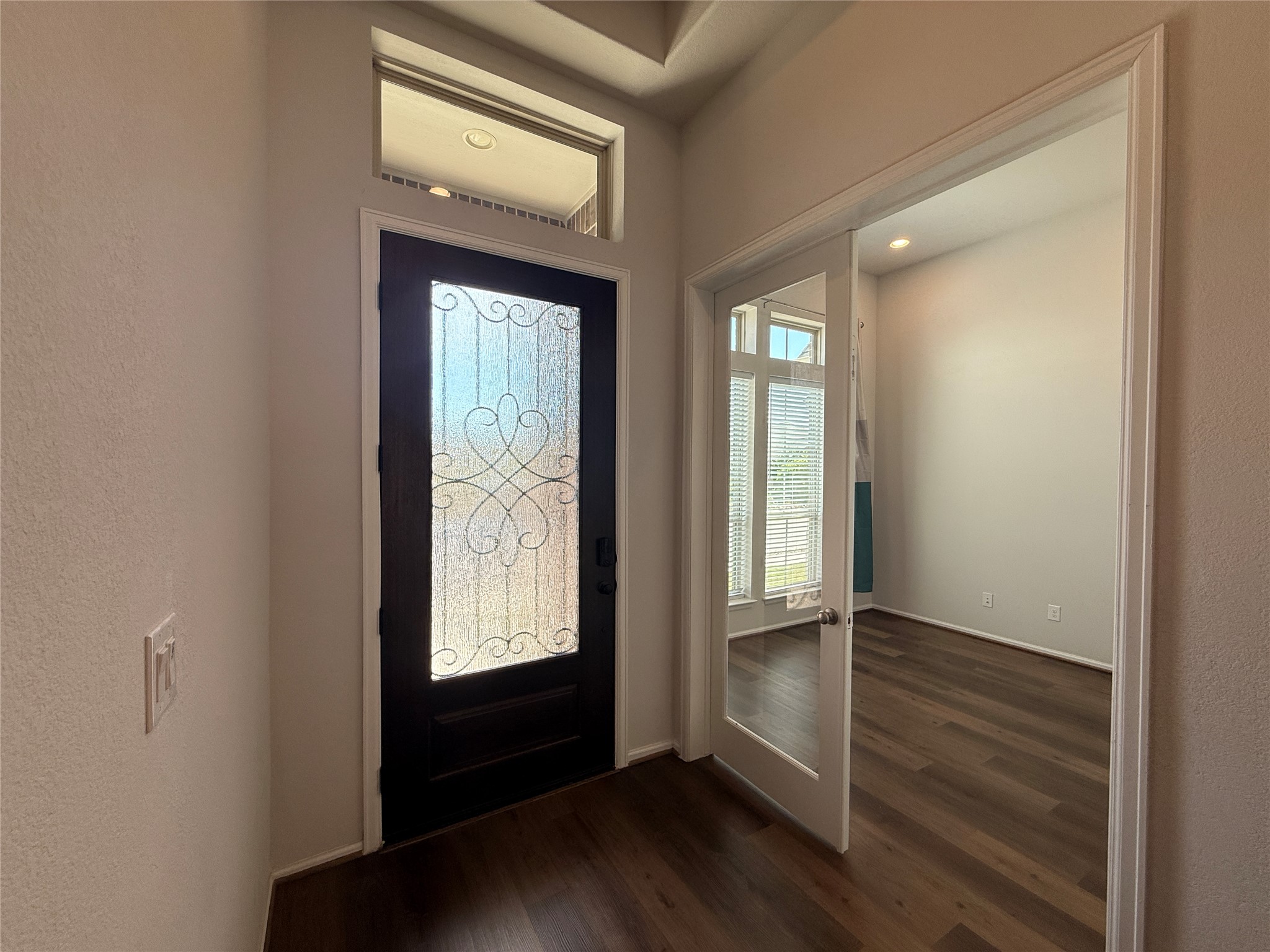 156 Santa Maria Street Georgetown, TX 78628 - Photo 4 of 39 a view of an entryway with wooden floor and door