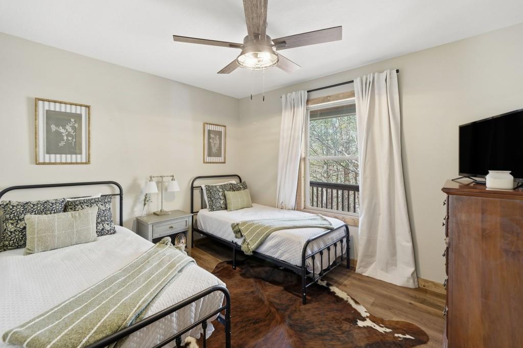 589 Spalding Circle Ellijay, GA 30540 - Photo 17 of 68 a bedroom with two beds and a tv