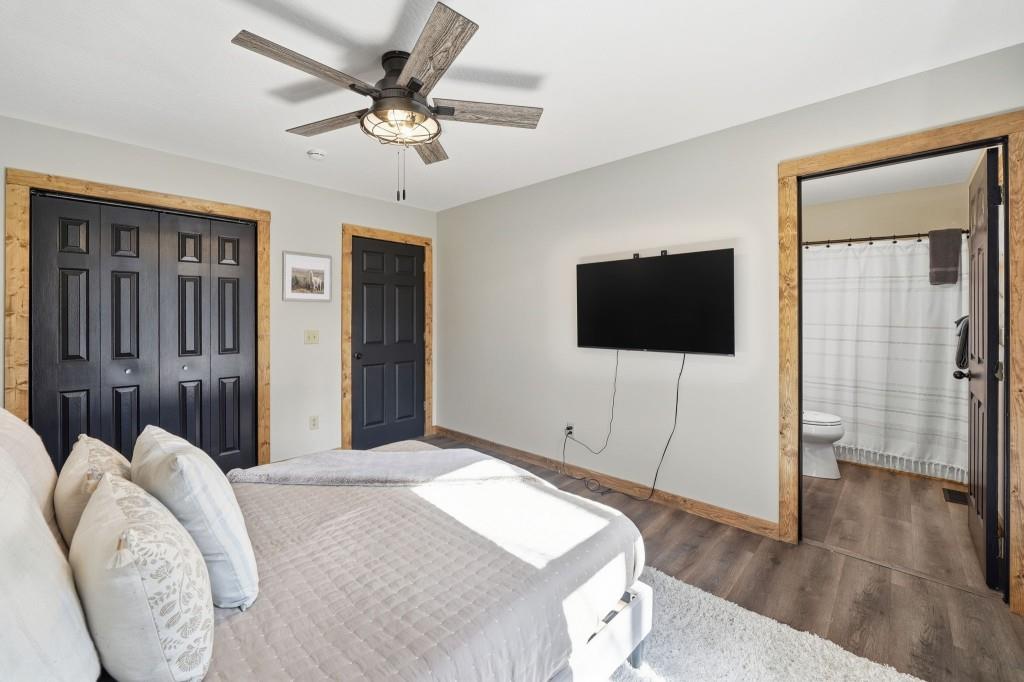 589 Spalding Circle Ellijay, GA 30540 - Photo 20 of 68 a bedroom with a bed and a flat screen tv