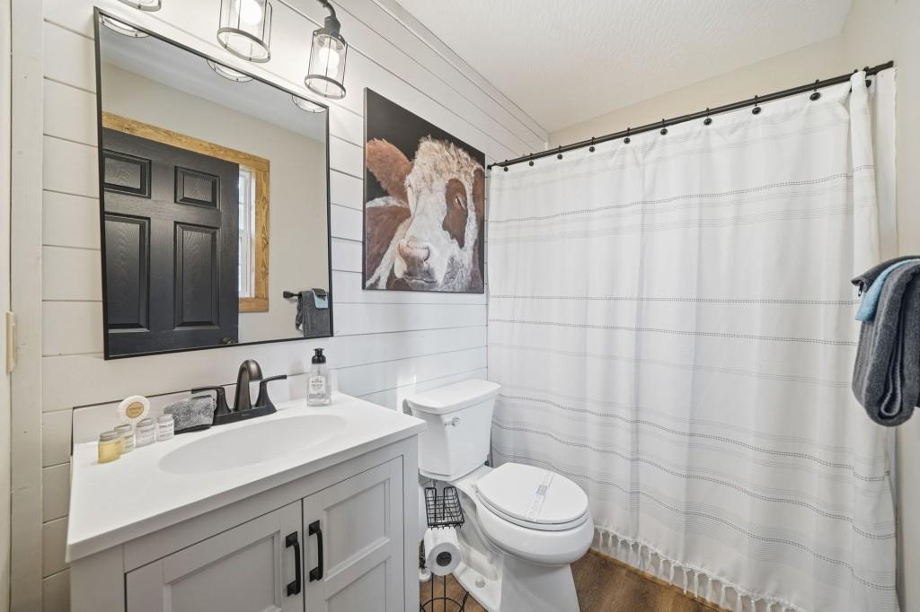 589 Spalding Circle Ellijay, GA 30540 - Photo 21 of 68 a bathroom with a sink mirror and toilet