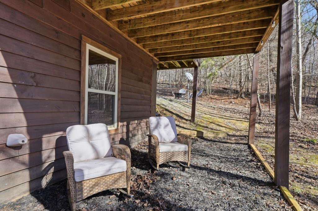 589 Spalding Circle Ellijay, GA 30540 - Photo 32 of 68 a view of a porch with furniture and a yard