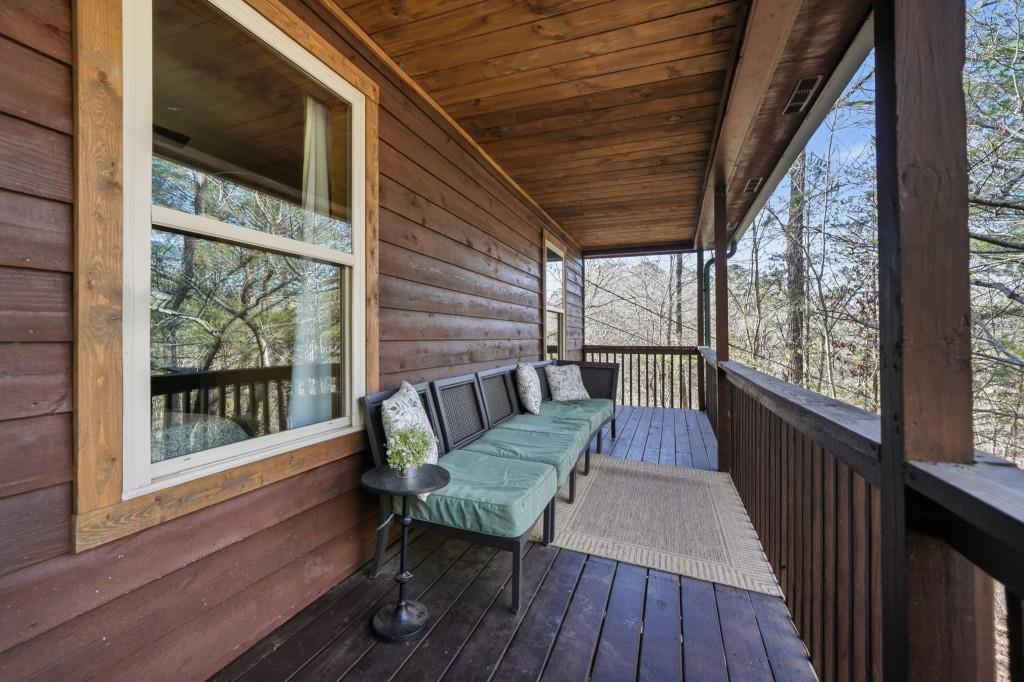 589 Spalding Circle Ellijay, GA 30540 - Photo 34 of 68 a balcony with wooden floor outdoor seating and wooden floor
