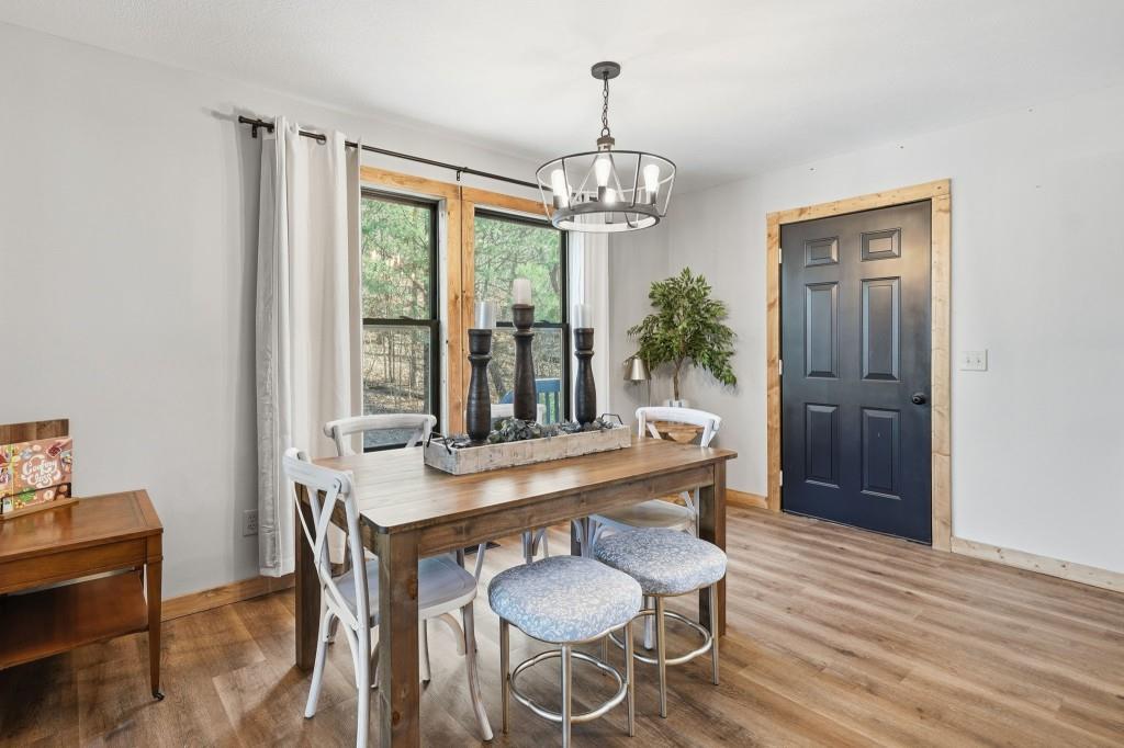 589 Spalding Circle Ellijay, GA 30540 - Photo 4 of 68 a view of a dining room with furniture wooden floor and chandelier