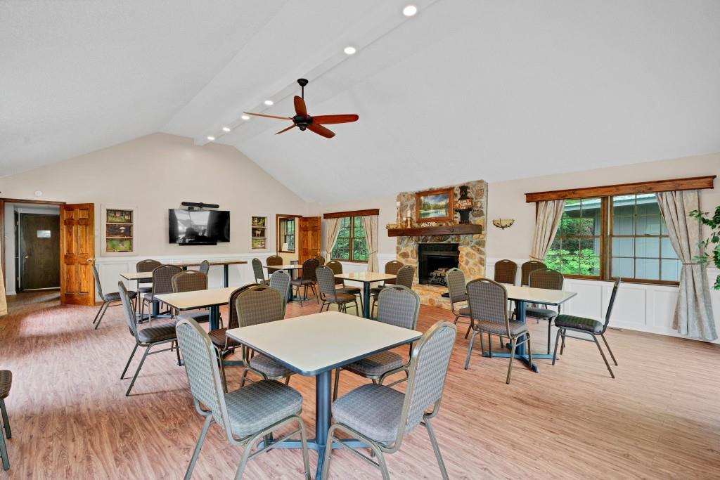 589 Spalding Circle Ellijay, GA 30540 - Photo 49 of 68 a view of a dining room with furniture window and wooden floor