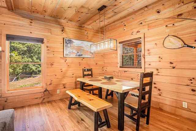a view of a patio with table and chairs and wooden floor