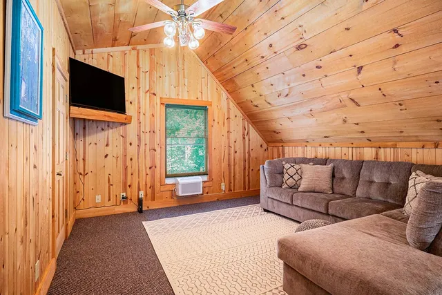 a view of a livingroom with furniture and front door