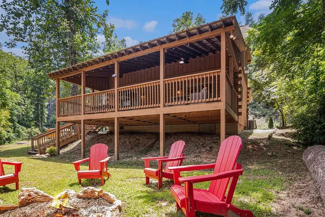a view of a chairs and table in backyard