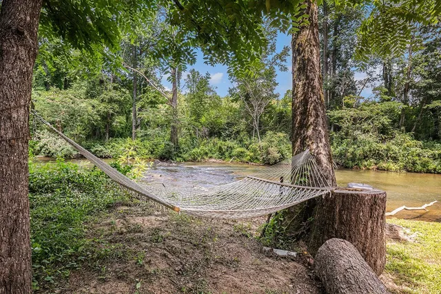 a view of a yard with a lake view