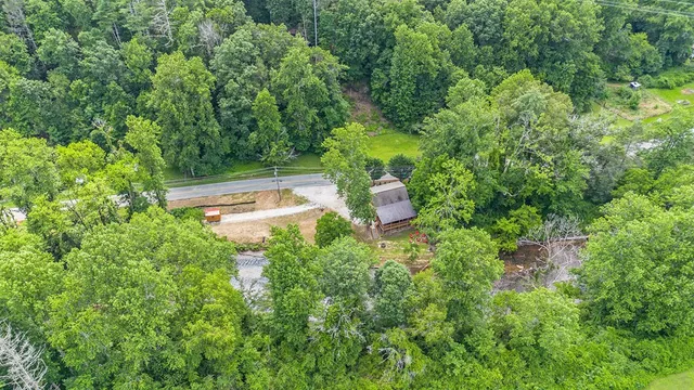 a view of a house with a yard and sitting area