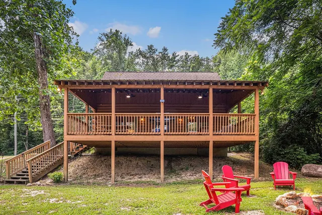 a view of a house with a yard porch and furniture