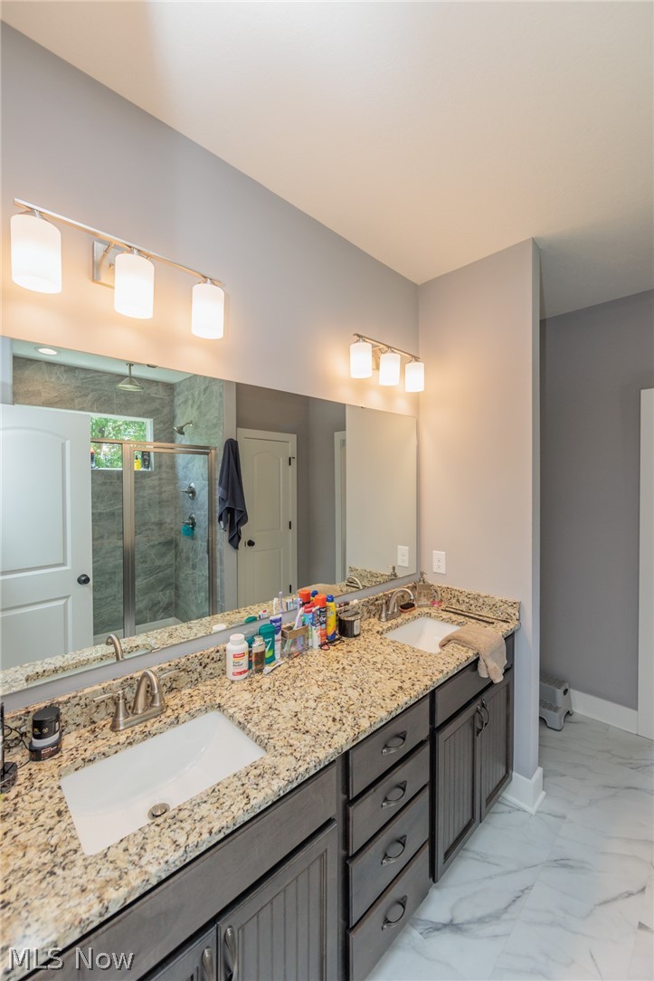12709 Chamberlain Road Aurora, OH 44202 - Photo 11 of 34 Bathroom with walk in shower, tile flooring, and double sink vanity