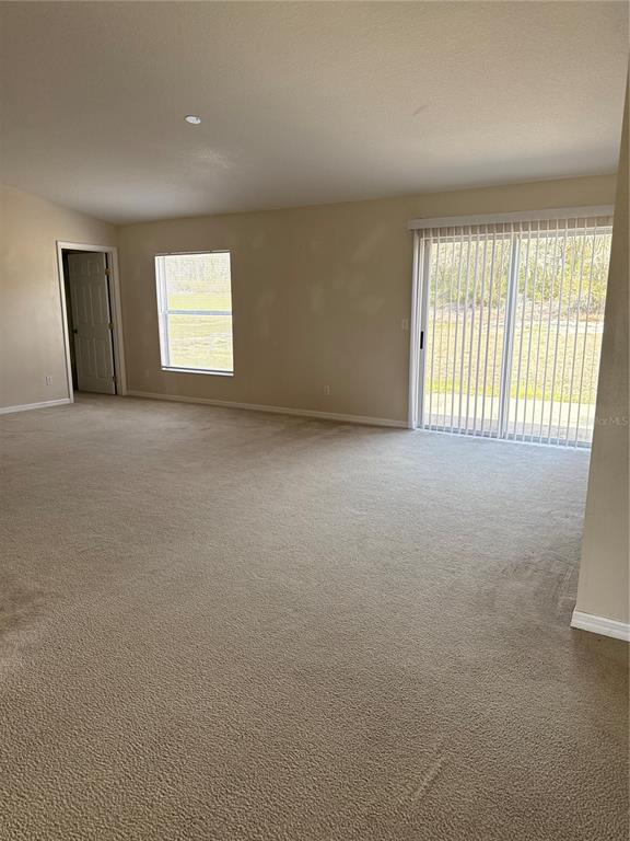 4725 Southwest 100th Street Ocala, FL 34476 - Photo 13 of 24 an empty room with windows