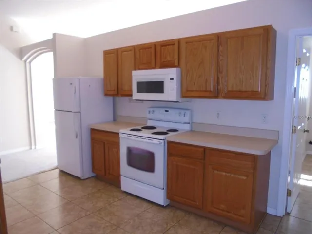 a kitchen with a stove and a microwave