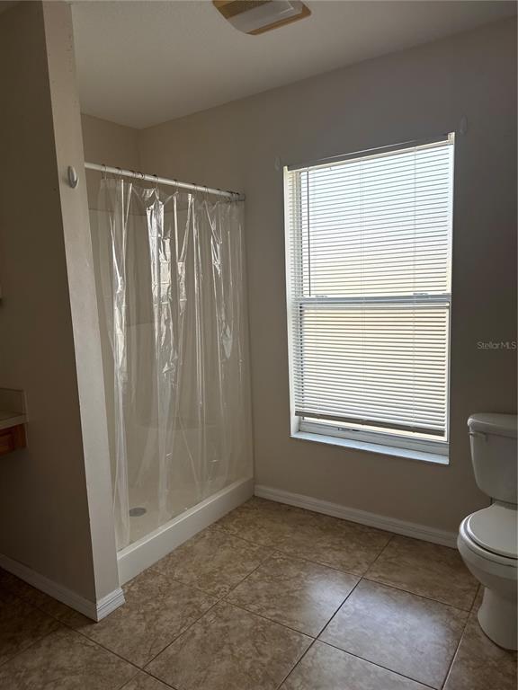 4725 Southwest 100th Street Ocala, FL 34476 - Photo 20 of 24 a view of an empty room with a window