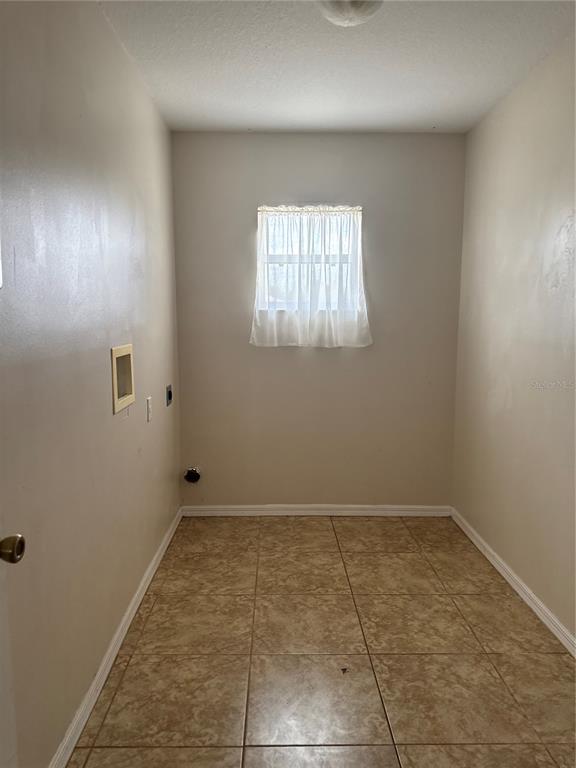 4725 Southwest 100th Street Ocala, FL 34476 - Photo 21 of 24 an empty room with a empty space and windows