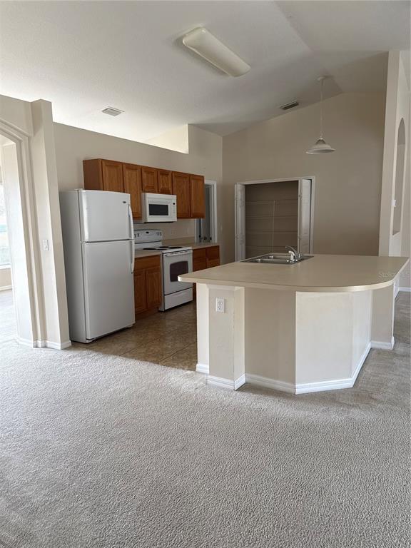4725 Southwest 100th Street Ocala, FL 34476 - Photo 8 of 24 a living room with a couch and a flat screen tv
