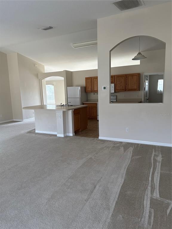 4725 Southwest 100th Street Ocala, FL 34476 - Photo 10 of 24 a view of a kitchen with a sink and a stove top oven