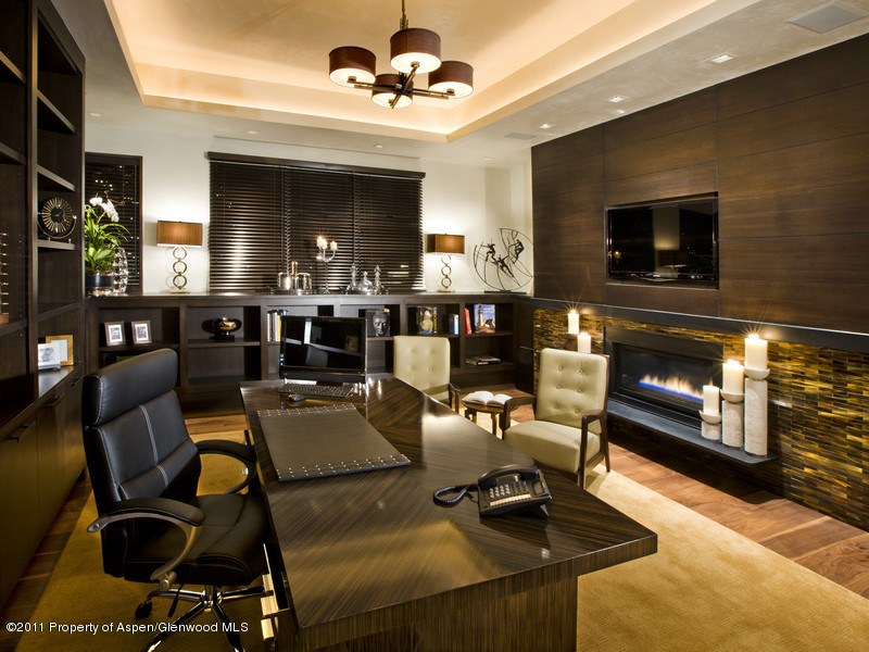 675 Aspen Alps Road South Aspen, CO 81611 - Photo 14 of 37 a living room with furniture a flat screen tv and a fireplace