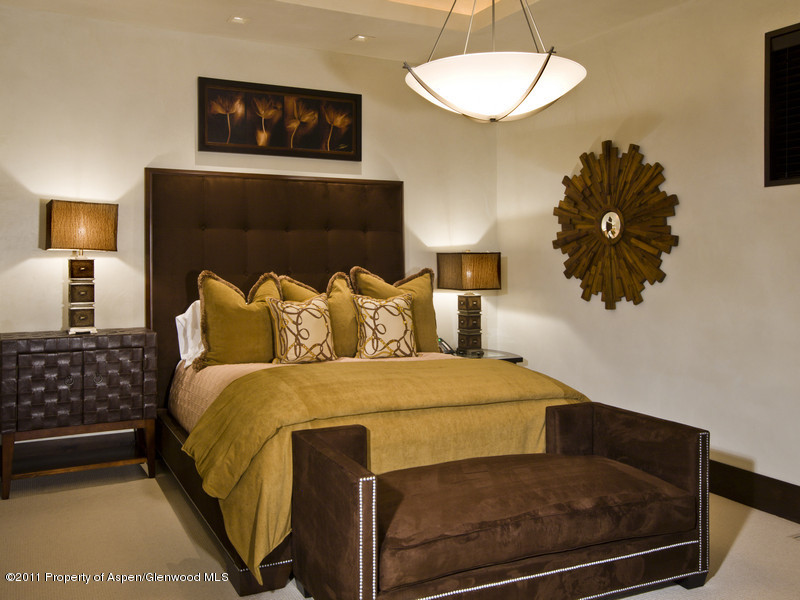 675 Aspen Alps Road South Aspen, CO 81611 - Photo 25 of 37 a bedroom with a bed and a lamp with the potted plant
