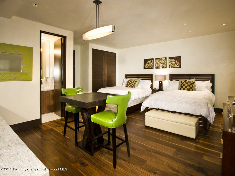 675 Aspen Alps Road South Aspen, CO 81611 - Photo 26 of 37 a bedroom with a bed and a table