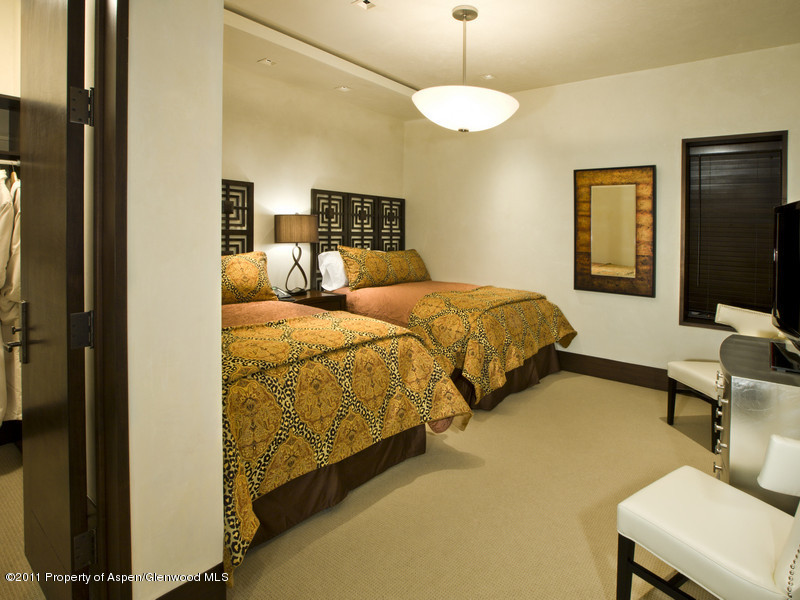 675 Aspen Alps Road South Aspen, CO 81611 - Photo 28 of 37 a bedroom with two beds and a flat screen tv