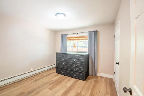 a room with a bed and a window