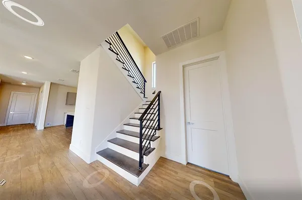 a view of entryway with wooden floor