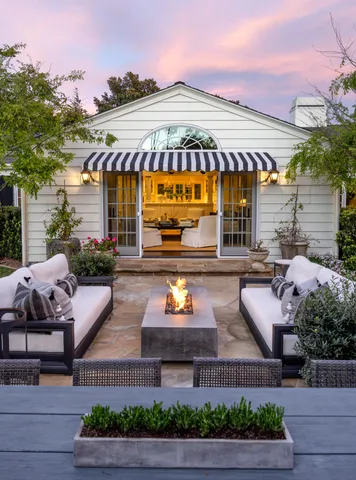 a view of a chairs and table in the patio
