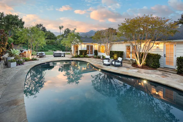 a view of swimming pool with outdoor seating
