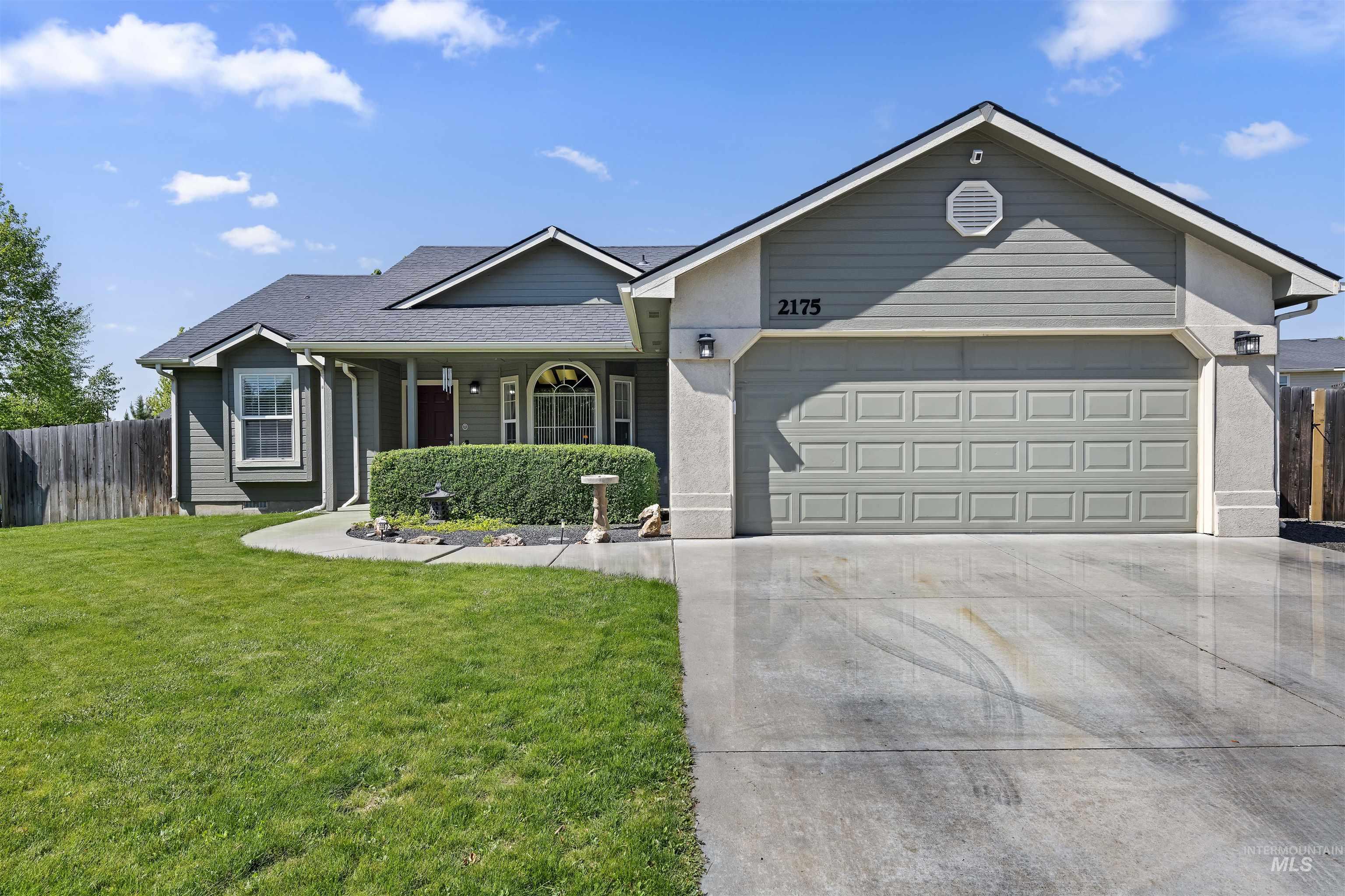 2175 North CapeCod Way Meridian, ID 83646 - Photo 2 of 23 Ranch-style residence featuring a prominent two-car garage with a panel door