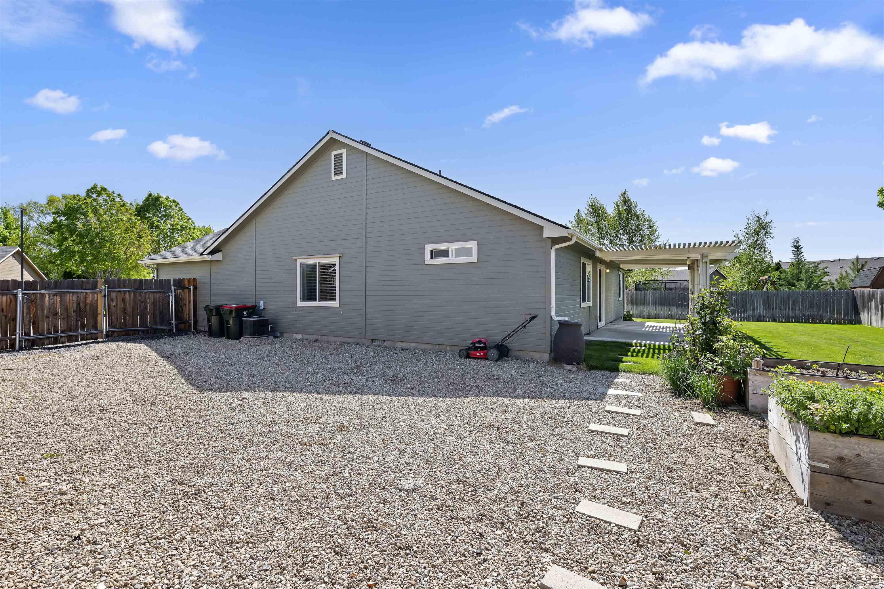 2175 North CapeCod Way Meridian, ID 83646 - Photo 23 of 23 Spacious gravel hardscaping with a concrete paver pathway