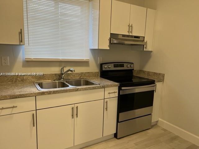 2139 Southwest 5th Street Miami, FL 33135 - Photo 13 of 19 a kitchen with a sink and a stove top oven