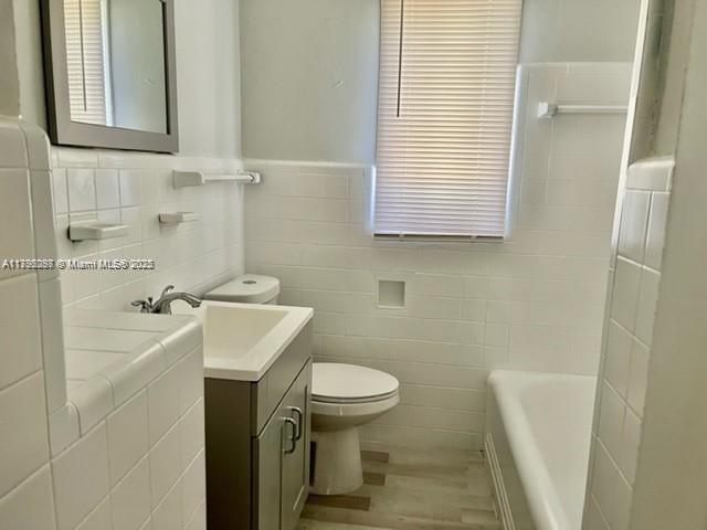 2139 Southwest 5th Street Miami, FL 33135 - Photo 19 of 19 a bathroom with a sink a toilet and a bathtub