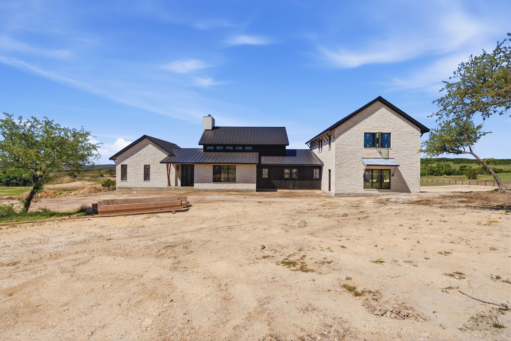 3300 Rm-165 Dripping Springs Dripping Springs, TX 78620 - Photo 6 of 25 a front view of a house with a yard