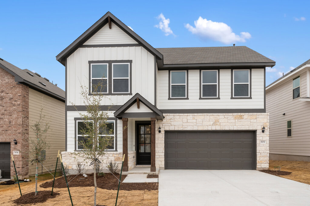 604 Palo Brea Loop Hutto, TX 78634 - Photo 1 of 1 a front view of a house with a yard