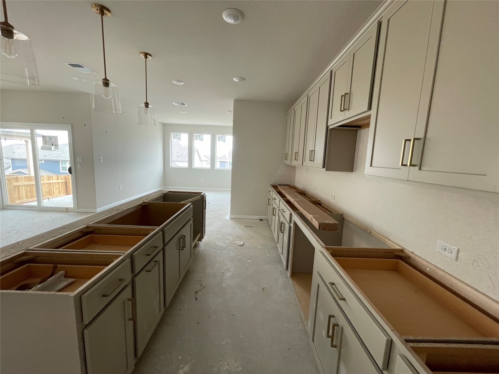 604 Palo Brea Loop Hutto, TX 78634 - Photo 14 of 36 a kitchen that has a sink and a stove