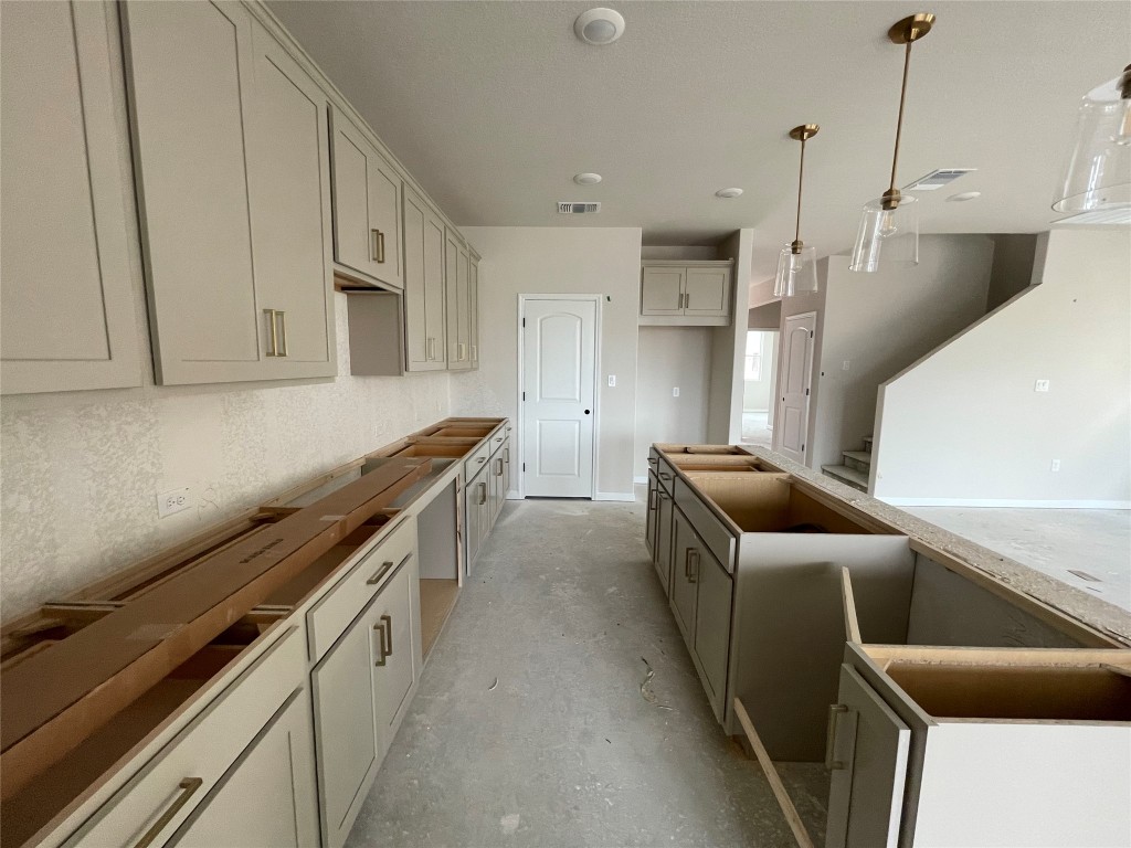 604 Palo Brea Loop Hutto, TX 78634 - Photo 15 of 36 a kitchen with stainless steel appliances sink refrigerator and stove