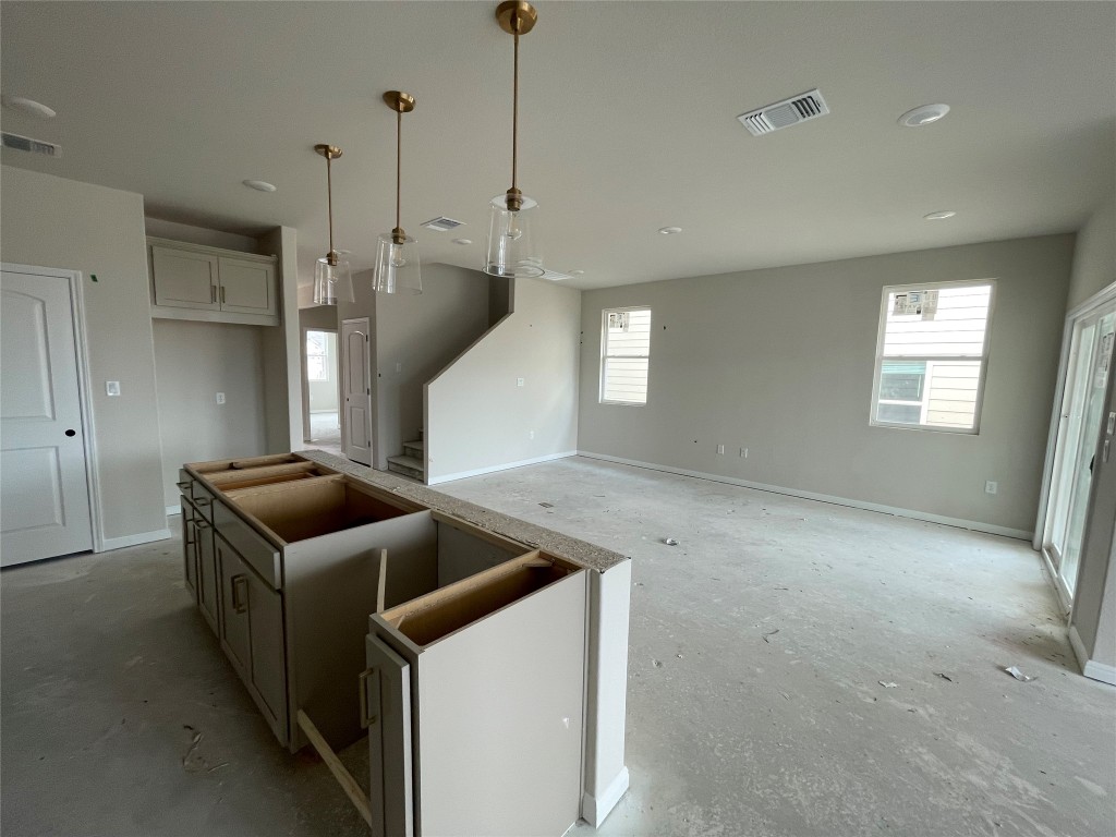 604 Palo Brea Loop Hutto, TX 78634 - Photo 16 of 36 a kitchen that has a sink and a stove