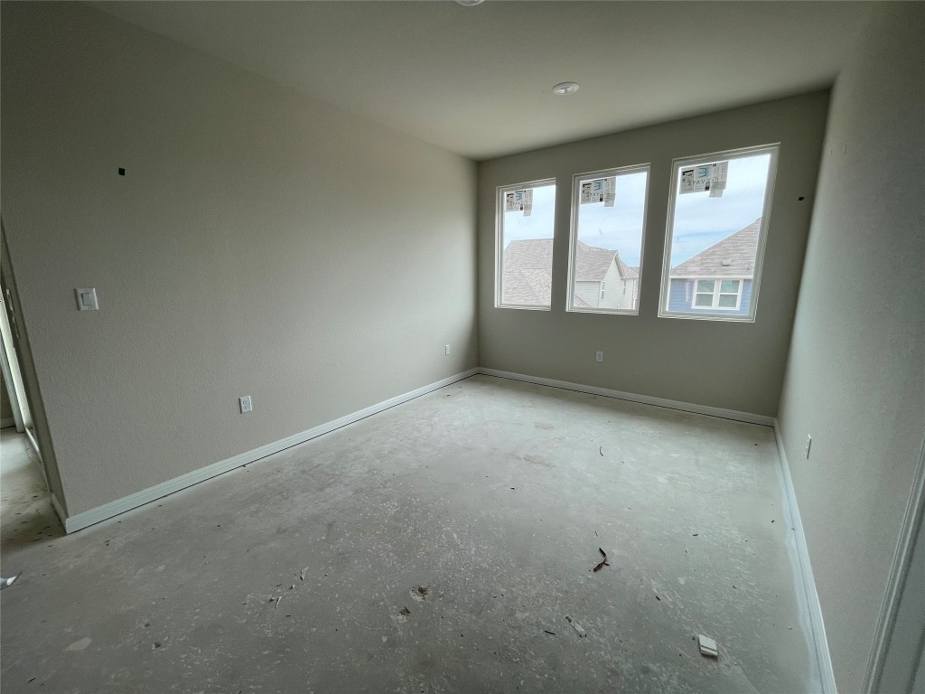 604 Palo Brea Loop Hutto, TX 78634 - Photo 17 of 36 an empty room with a window