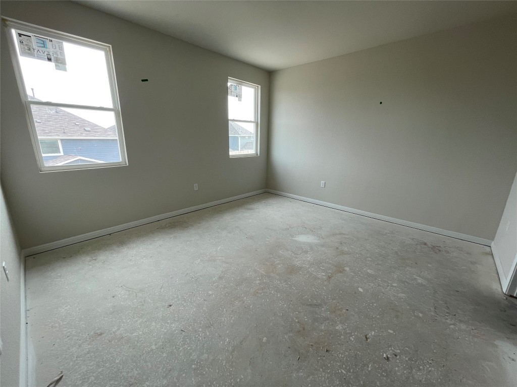 604 Palo Brea Loop Hutto, TX 78634 - Photo 18 of 36 an empty room with windows