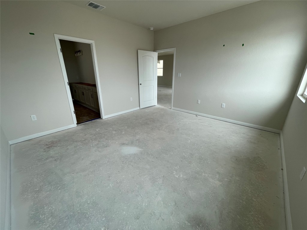604 Palo Brea Loop Hutto, TX 78634 - Photo 19 of 36 an empty room with a bathroom