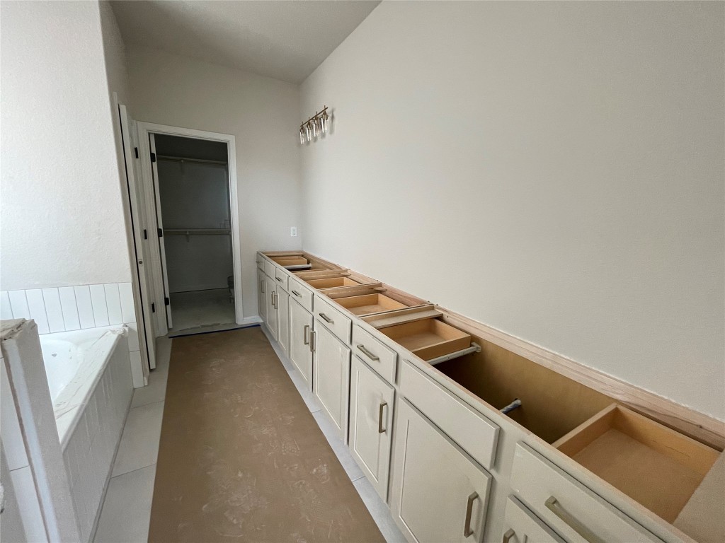 604 Palo Brea Loop Hutto, TX 78634 - Photo 20 of 36 a kitchen with a cabinets and white appliances
