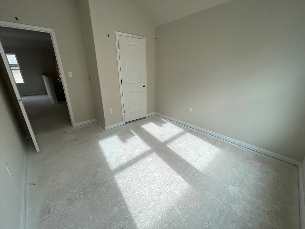 604 Palo Brea Loop Hutto, TX 78634 - Photo 27 of 36 a view of an empty room and a hallway
